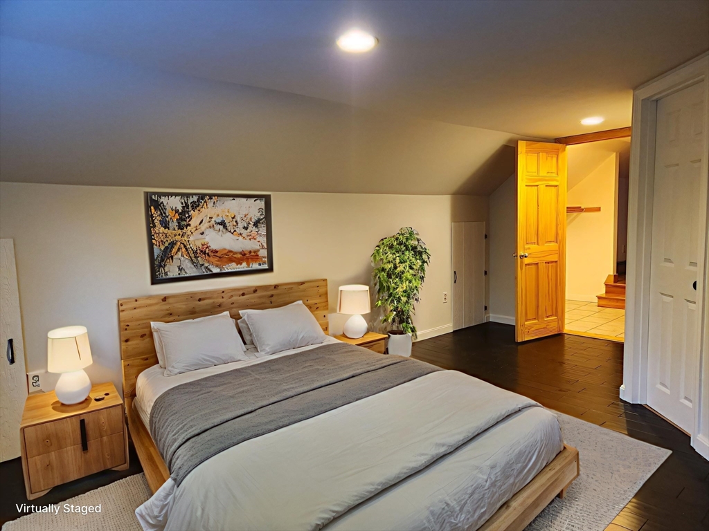 17 Diamond Hill Road, Unit B Jefferson, MA 01522 - Photo 3 of 8 a bedroom with a bed and a painting on the wall