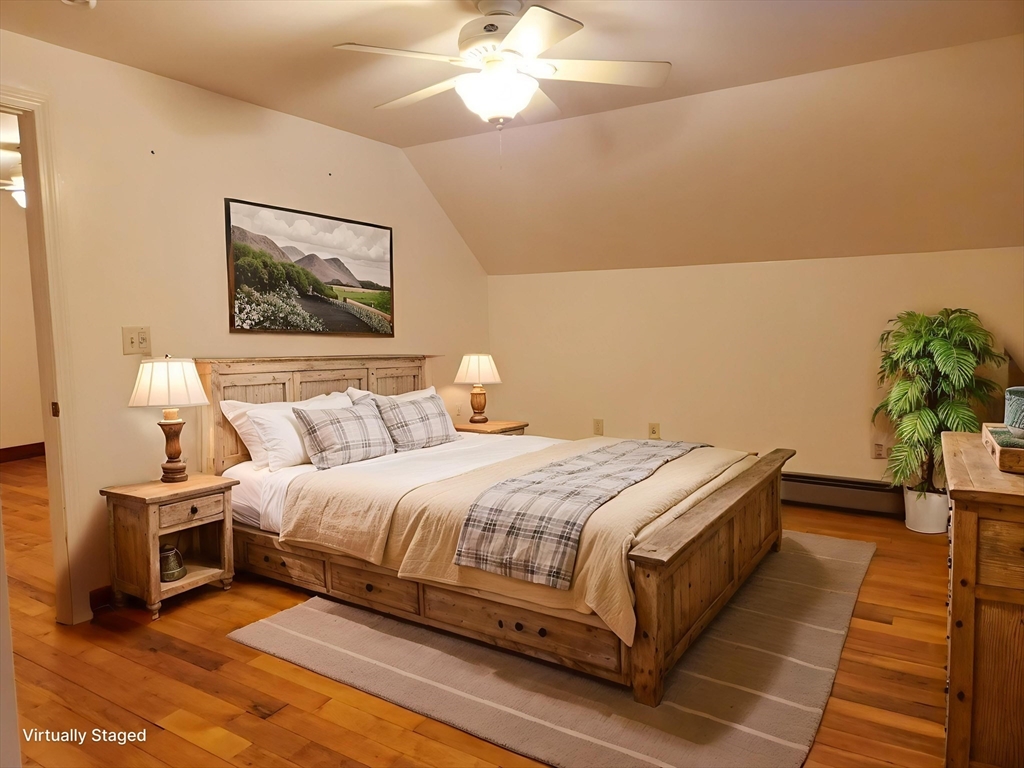 17 Diamond Hill Road, Unit B Jefferson, MA 01522 - Photo 4 of 8 a bedroom with bed and a potted plant on the dresser