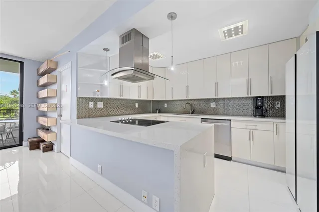 a kitchen with a stove a sink and a refrigerator