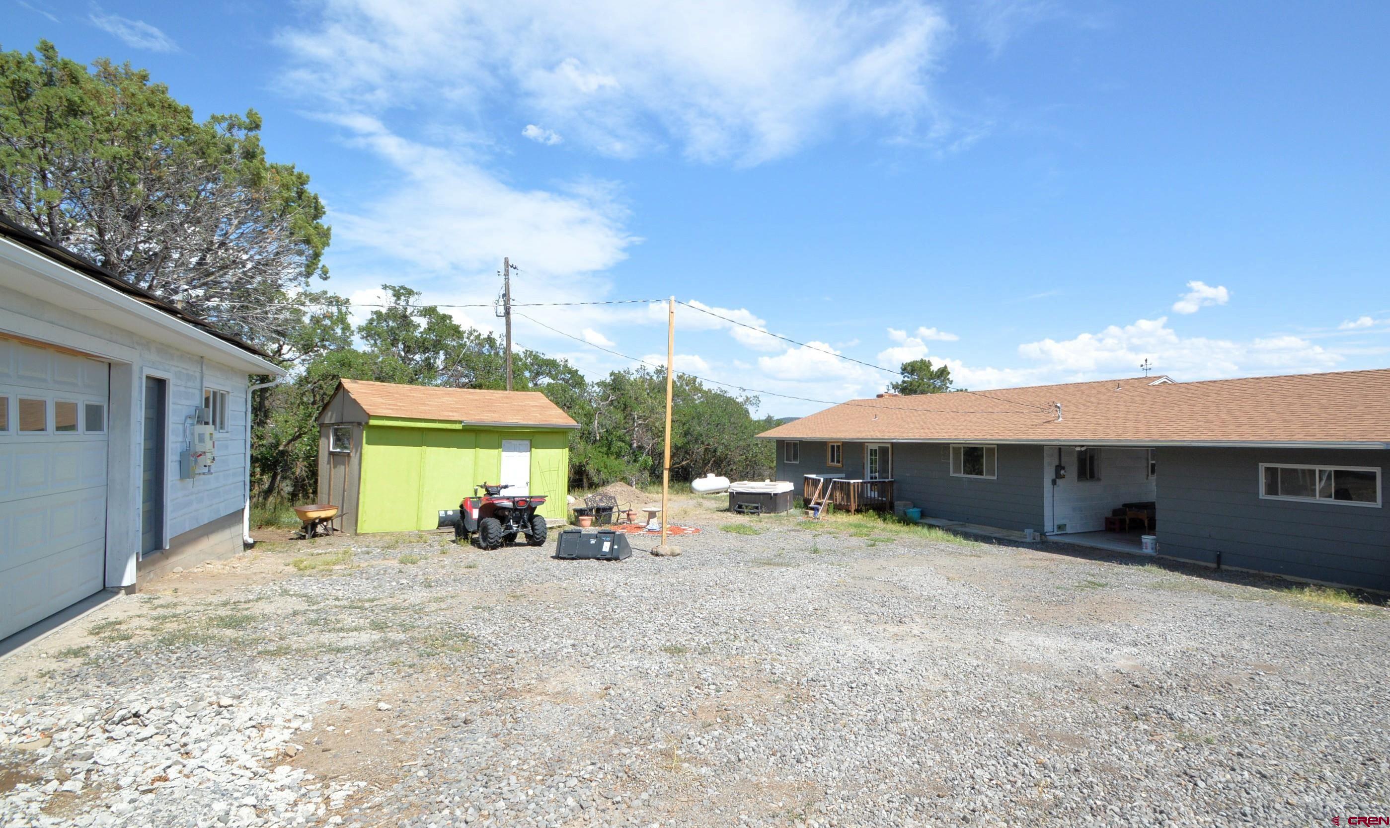 22755 Uintah Road Cedaredge, CO 81413 - Photo 19 of 21 a view of a house with a patio