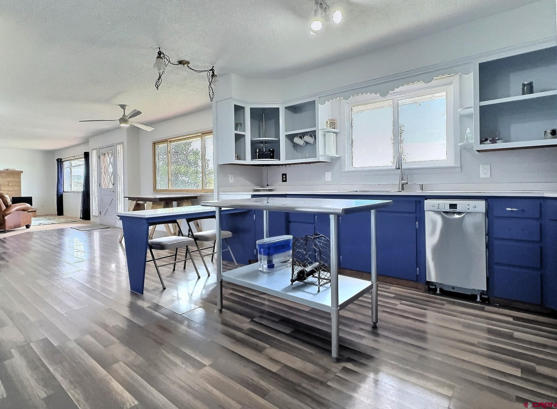 22755 Uintah Road Cedaredge, CO 81413 - Photo 5 of 21 a living room with granite countertop furniture and wooden floor