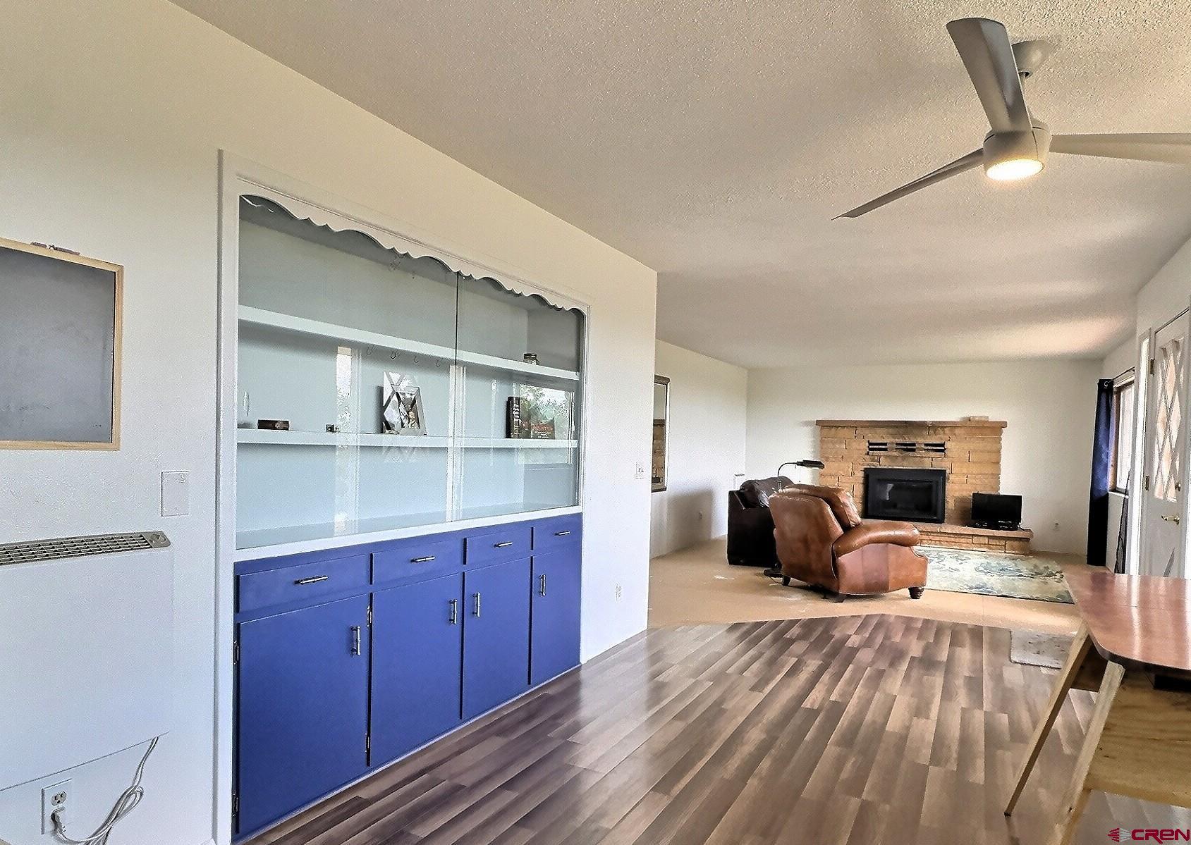 22755 Uintah Road Cedaredge, CO 81413 - Photo 7 of 21 a large bedroom with a bed and wooden floor