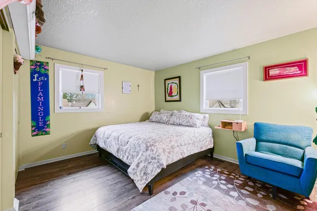 a bedroom with a bed and a couch