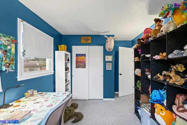 a bedroom with a bed and a bed