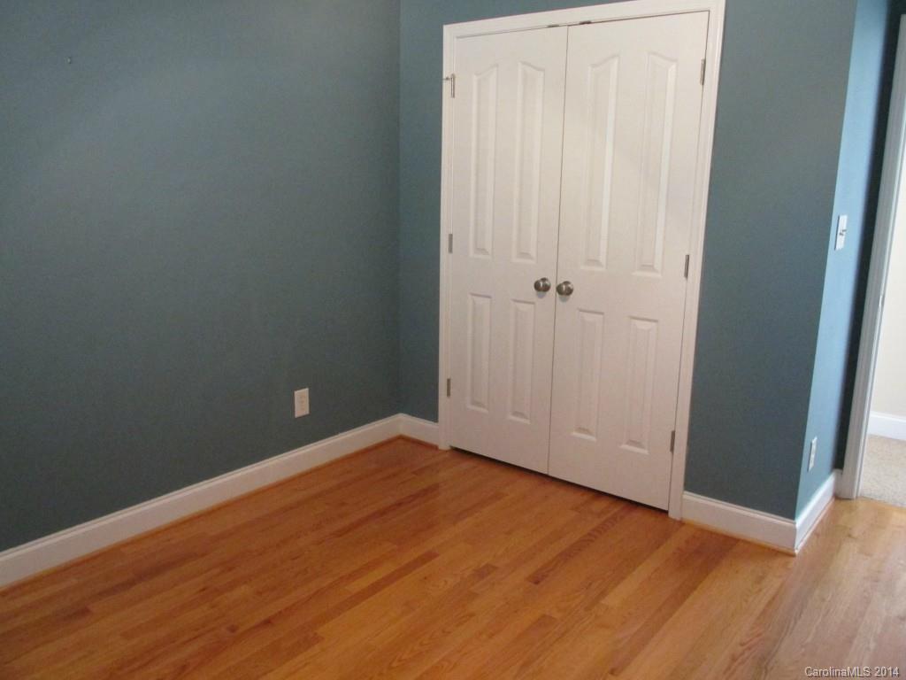 1842 Sam Smith Road, Unit 7 Fort Mill, SC 29708 - Photo 12 of 16 an empty room with wooden floor