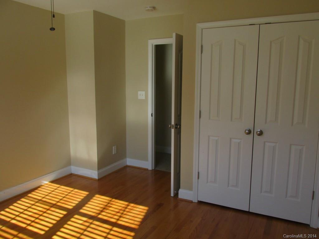1842 Sam Smith Road, Unit 7 Fort Mill, SC 29708 - Photo 13 of 16 a view of a bedroom with wooden floor