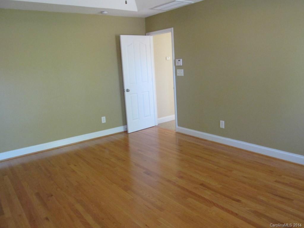 1842 Sam Smith Road, Unit 7 Fort Mill, SC 29708 - Photo 15 of 16 a view of an empty room with wooden floor