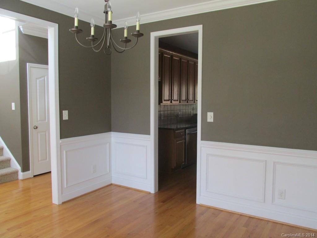 1842 Sam Smith Road, Unit 7 Fort Mill, SC 29708 - Photo 9 of 16 an empty room with wooden floor and cabinet