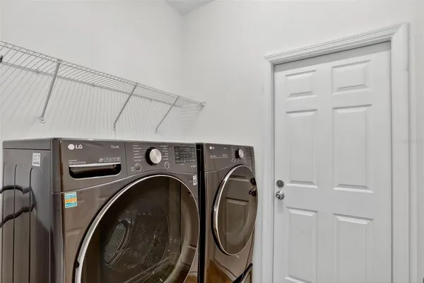 a utility room with dryer and washer