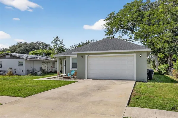 a front view of house with yard and green space
