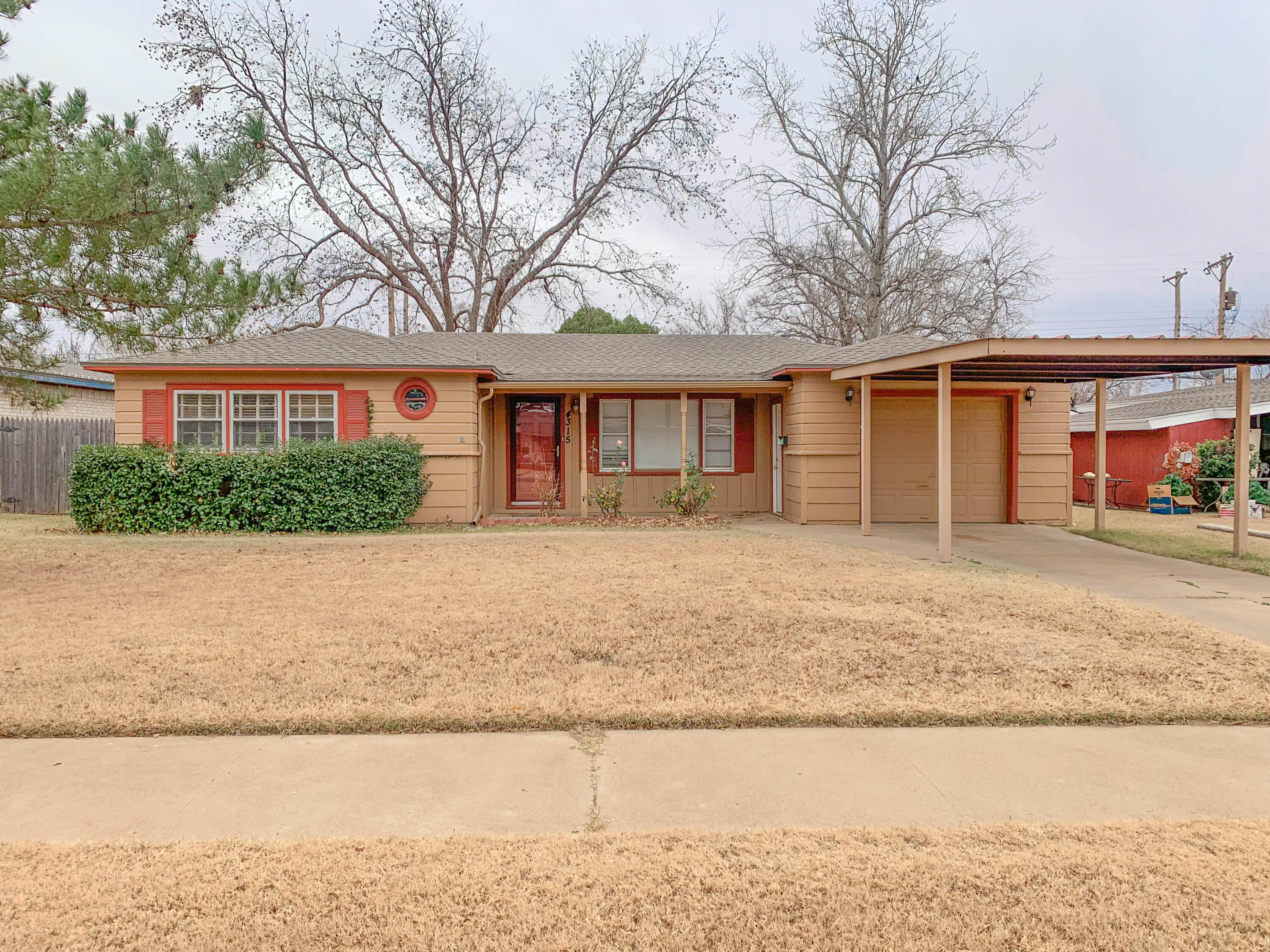 4315 42nd Street Lubbock, TX 79413 - Photo 1 of 11 front view of a house with a yard