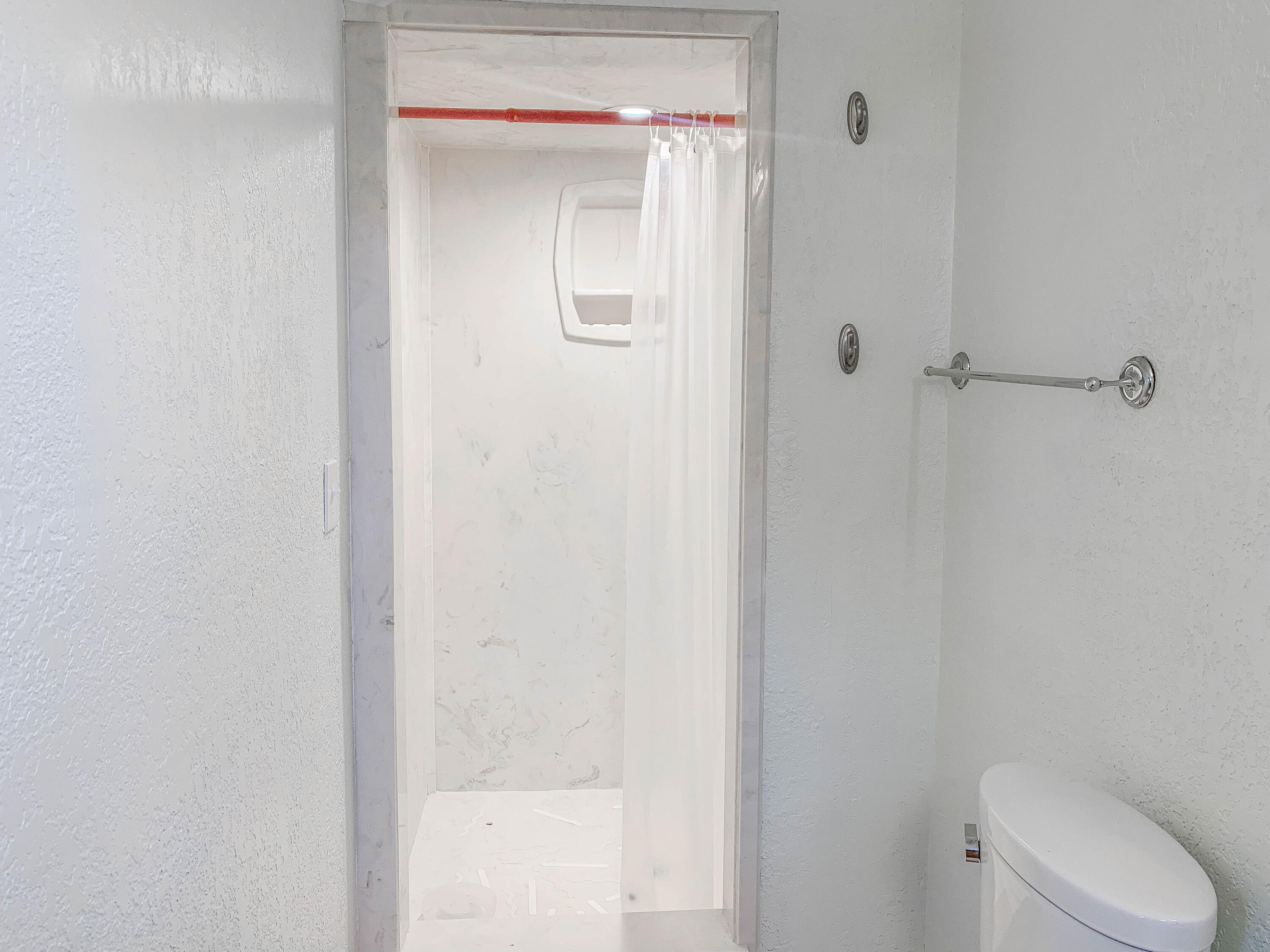 4315 42nd Street Lubbock, TX 79413 - Photo 10 of 11 a bathroom with a shower and a toilet