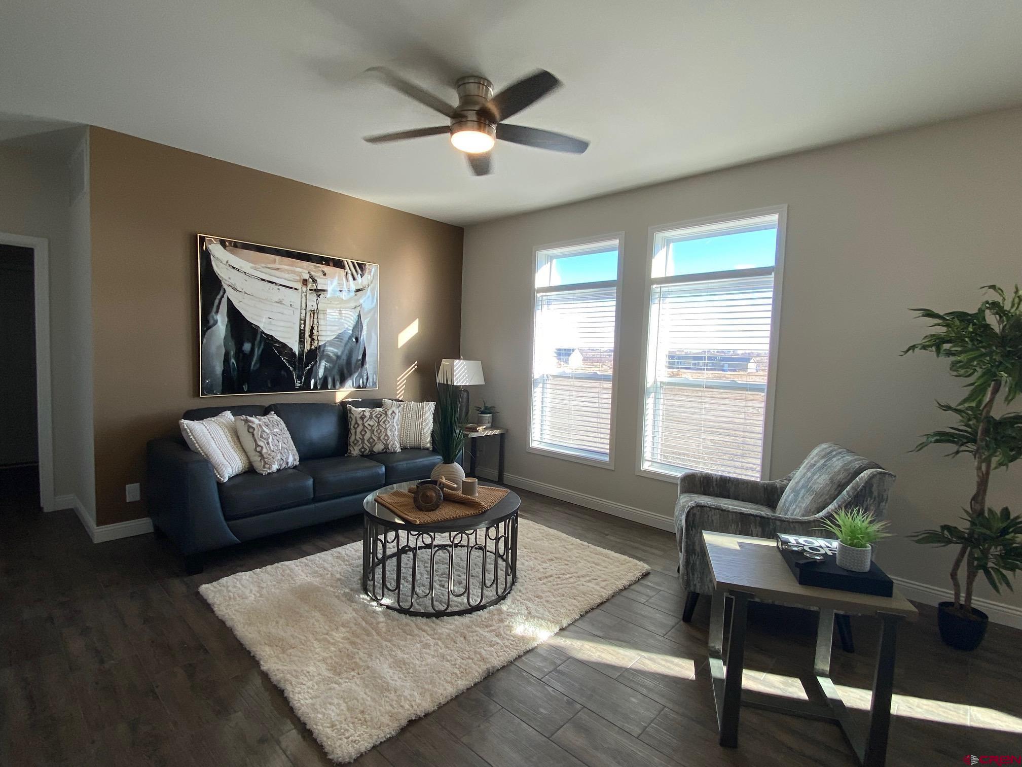 1230 H25 Road Delta, CO 81416 - Photo 11 of 34 a living room with furniture and a large window