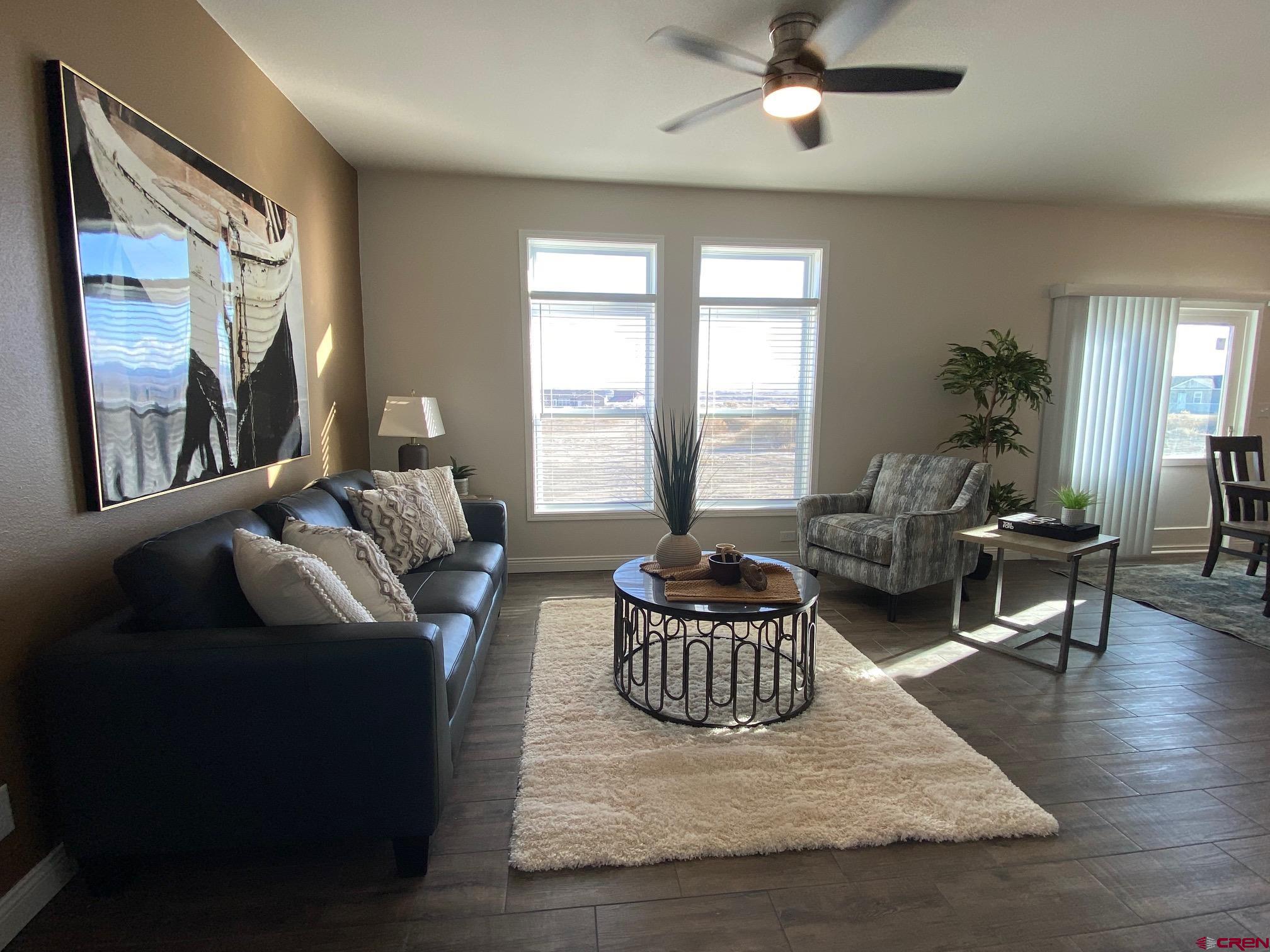 1230 H25 Road Delta, CO 81416 - Photo 12 of 34 a living room with furniture and a large window