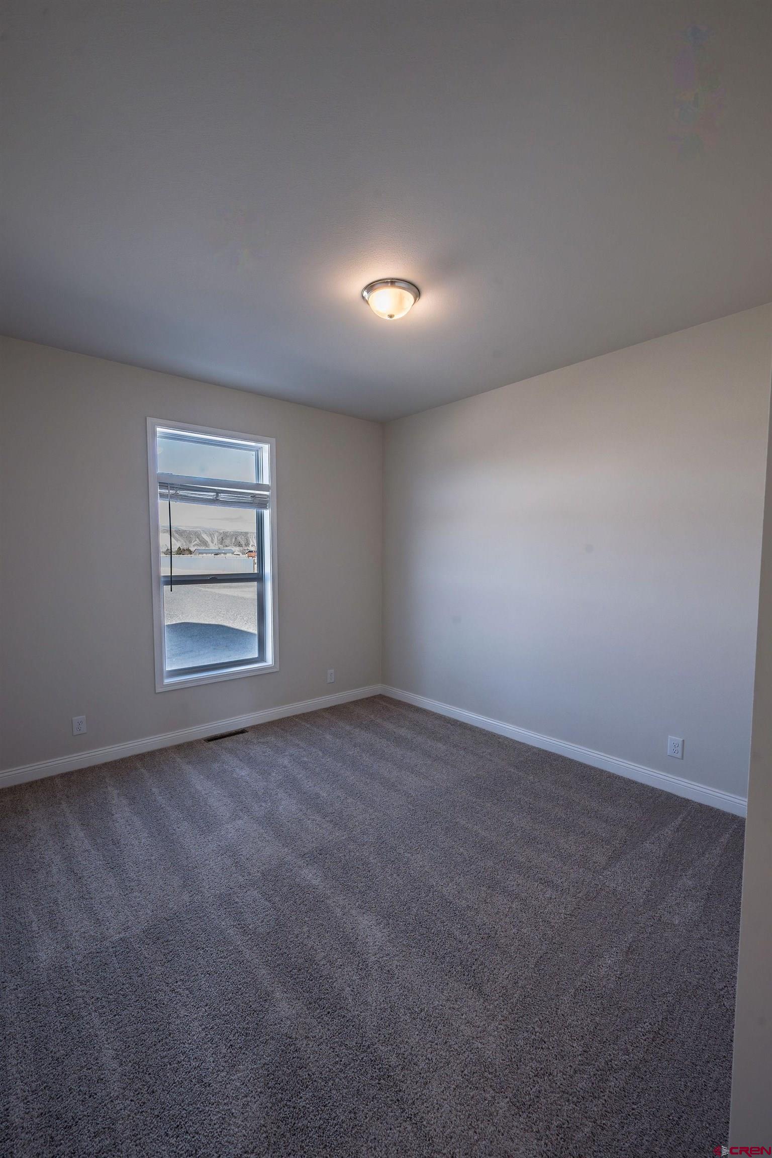 1230 H25 Road Delta, CO 81416 - Photo 14 of 34 an empty room with a window