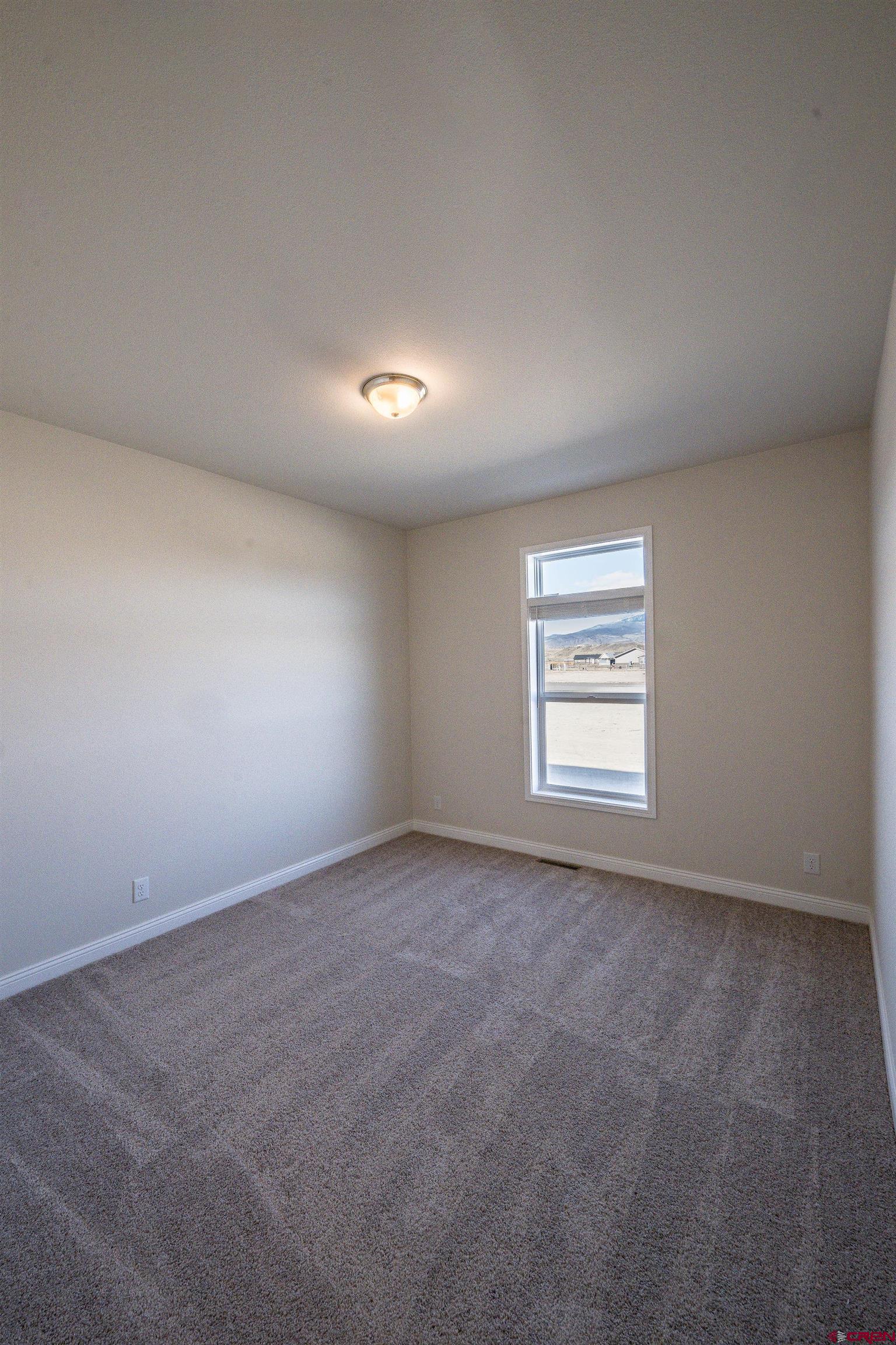 1230 H25 Road Delta, CO 81416 - Photo 15 of 34 an empty room with a window