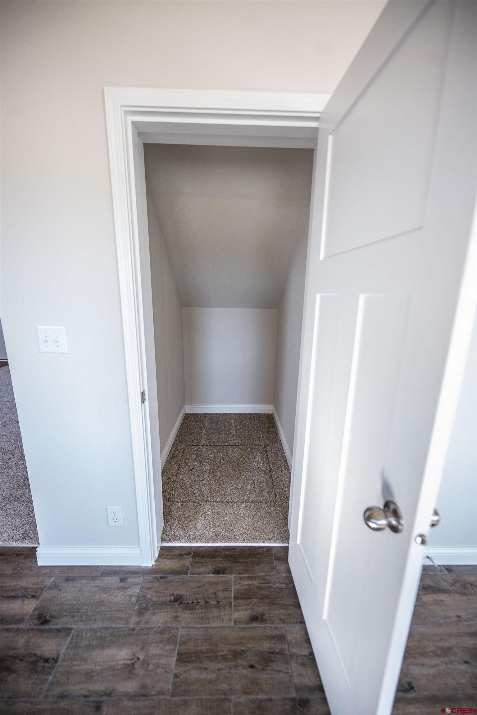 1230 H25 Road Delta, CO 81416 - Photo 17 of 34 an empty room with wooden floor and white walls