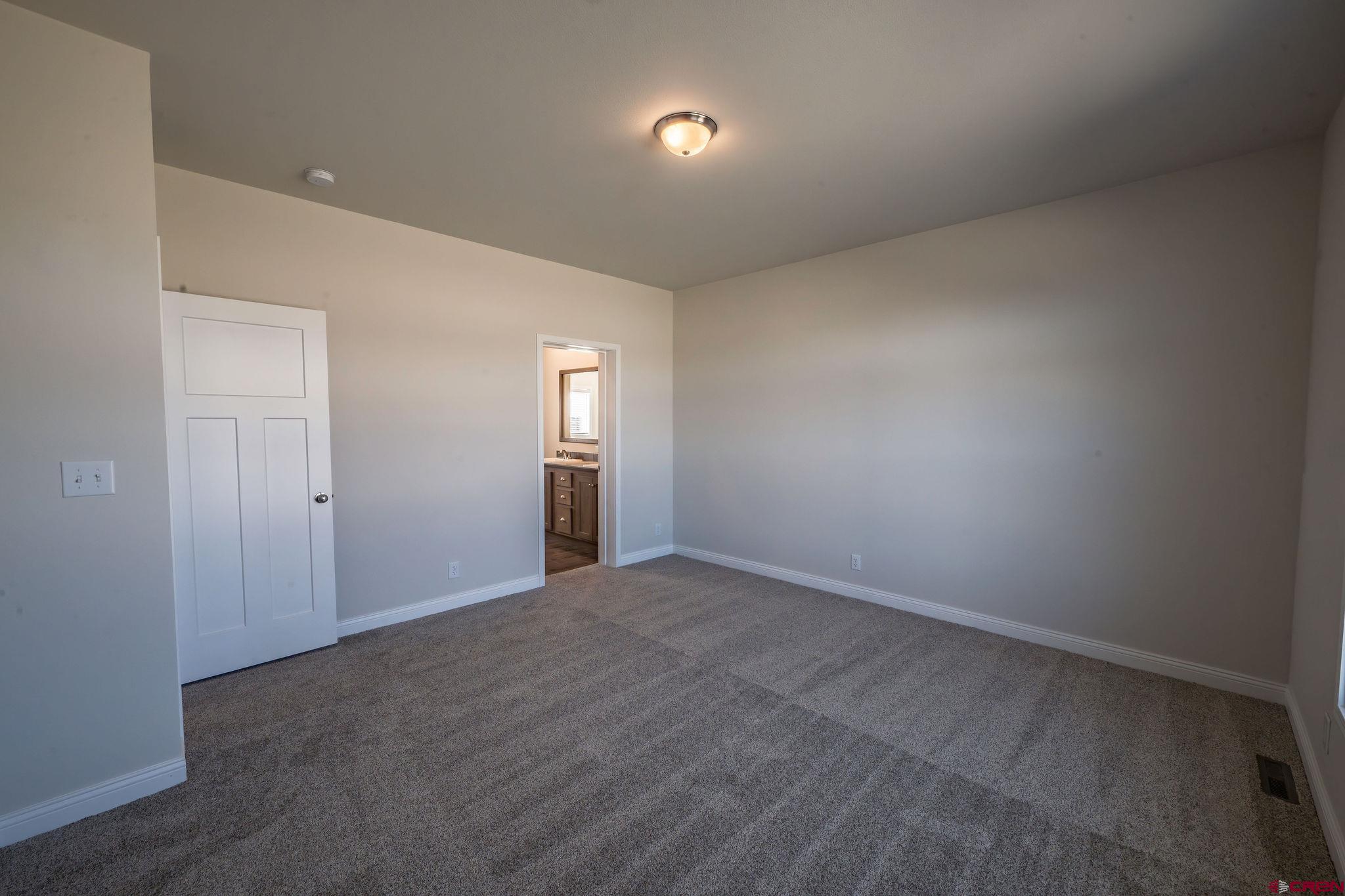 1230 H25 Road Delta, CO 81416 - Photo 19 of 34 a view of an empty room and a window
