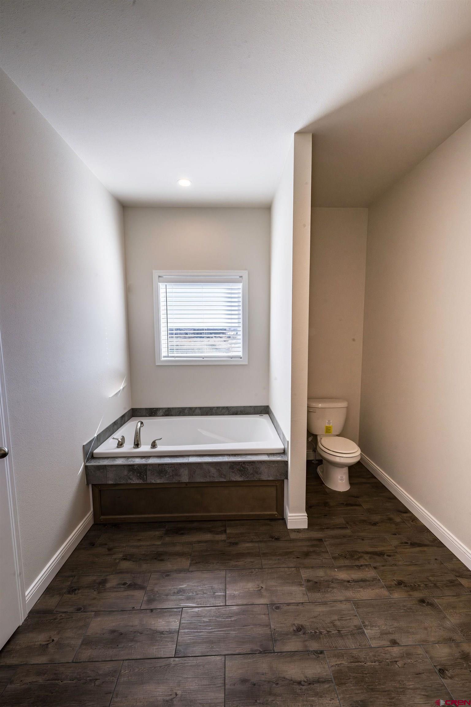 1230 H25 Road Delta, CO 81416 - Photo 21 of 34 a view of room with wooden floor