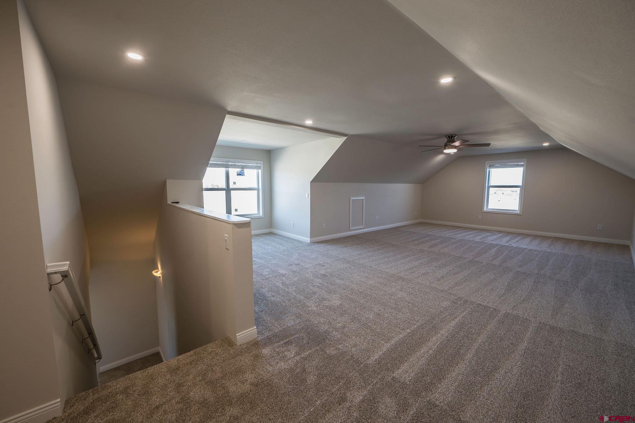 1230 H25 Road Delta, CO 81416 - Photo 24 of 34 en empty room with windows and refrigerator
