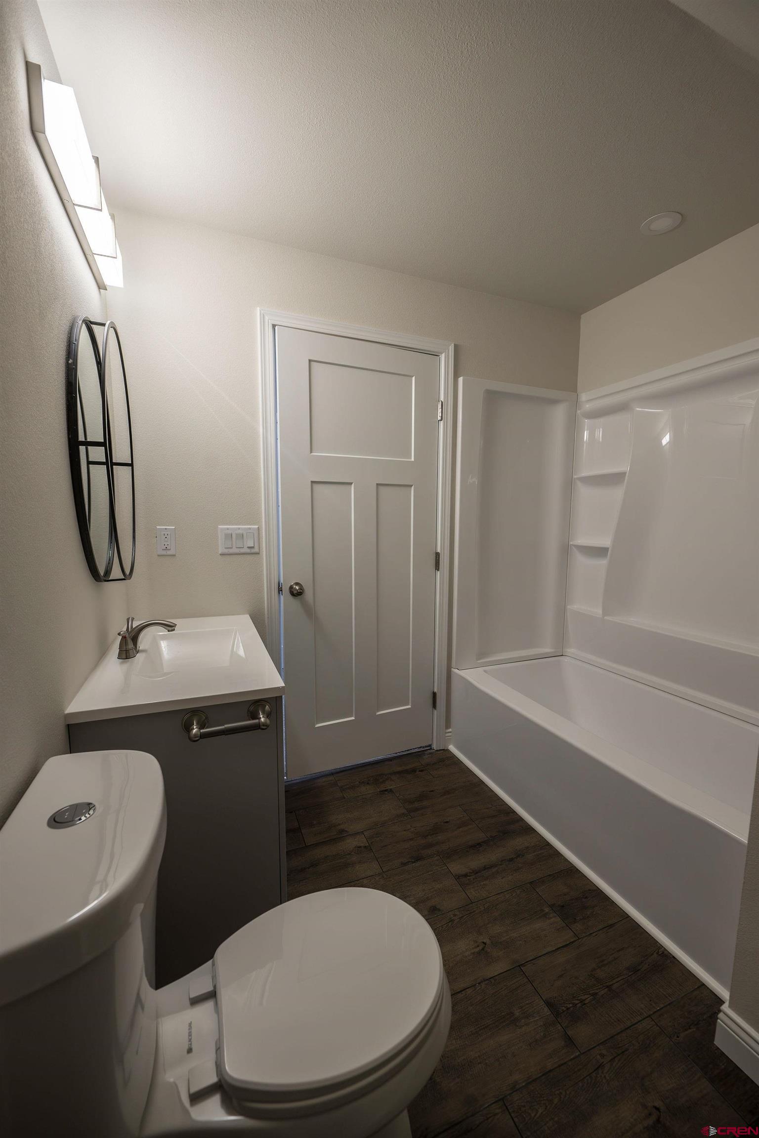 1230 H25 Road Delta, CO 81416 - Photo 26 of 34 a bathroom with a toilet a sink and bathtub