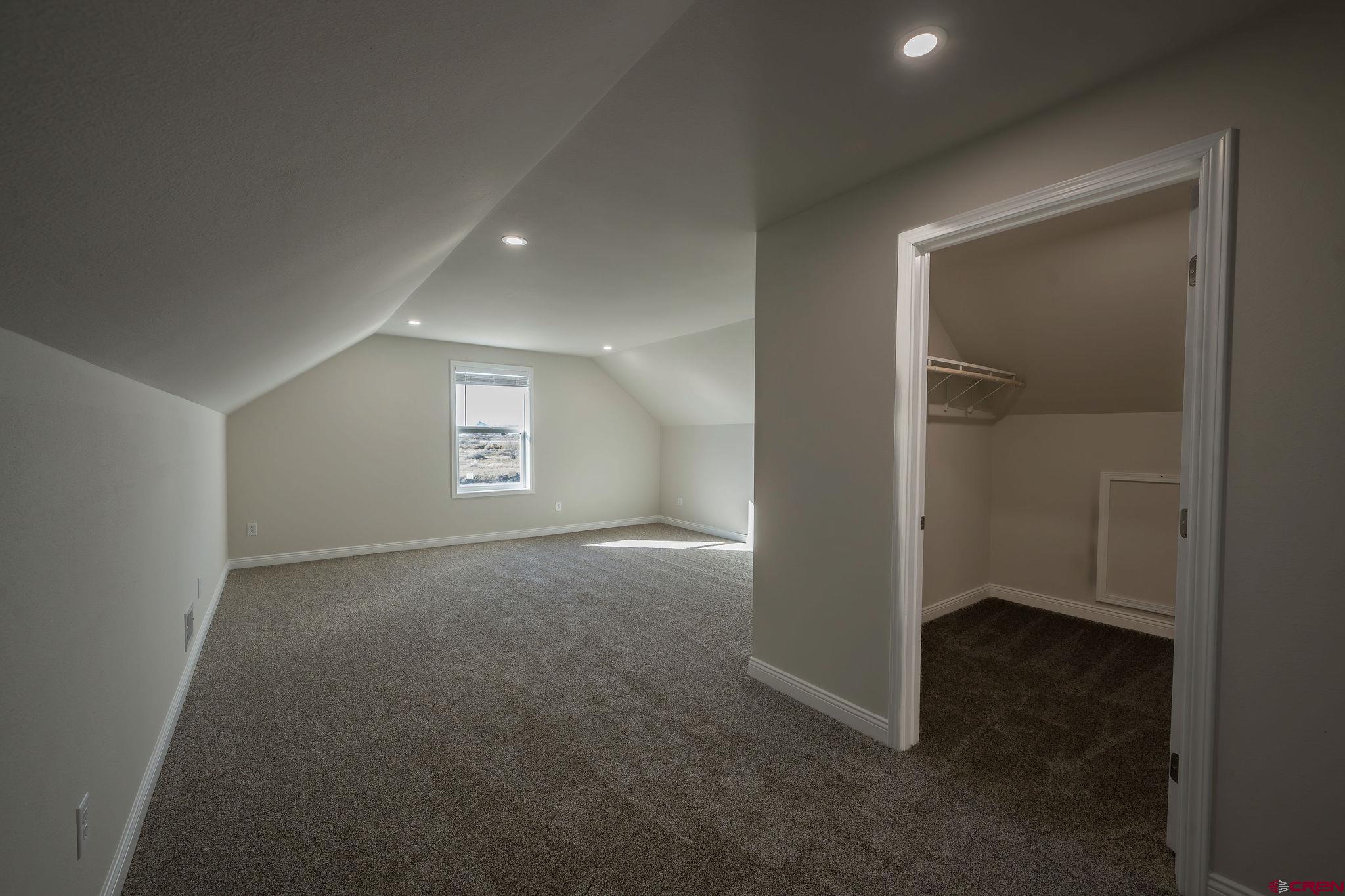 1230 H25 Road Delta, CO 81416 - Photo 27 of 34 an empty room with closet and a window