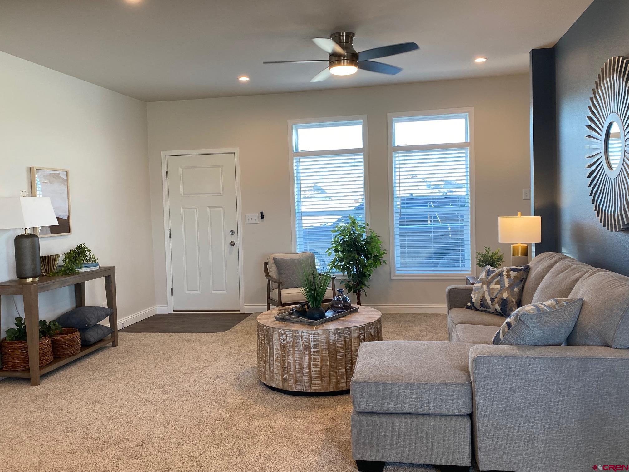 1230 H25 Road Delta, CO 81416 - Photo 4 of 34 a living room with furniture and a potted plant