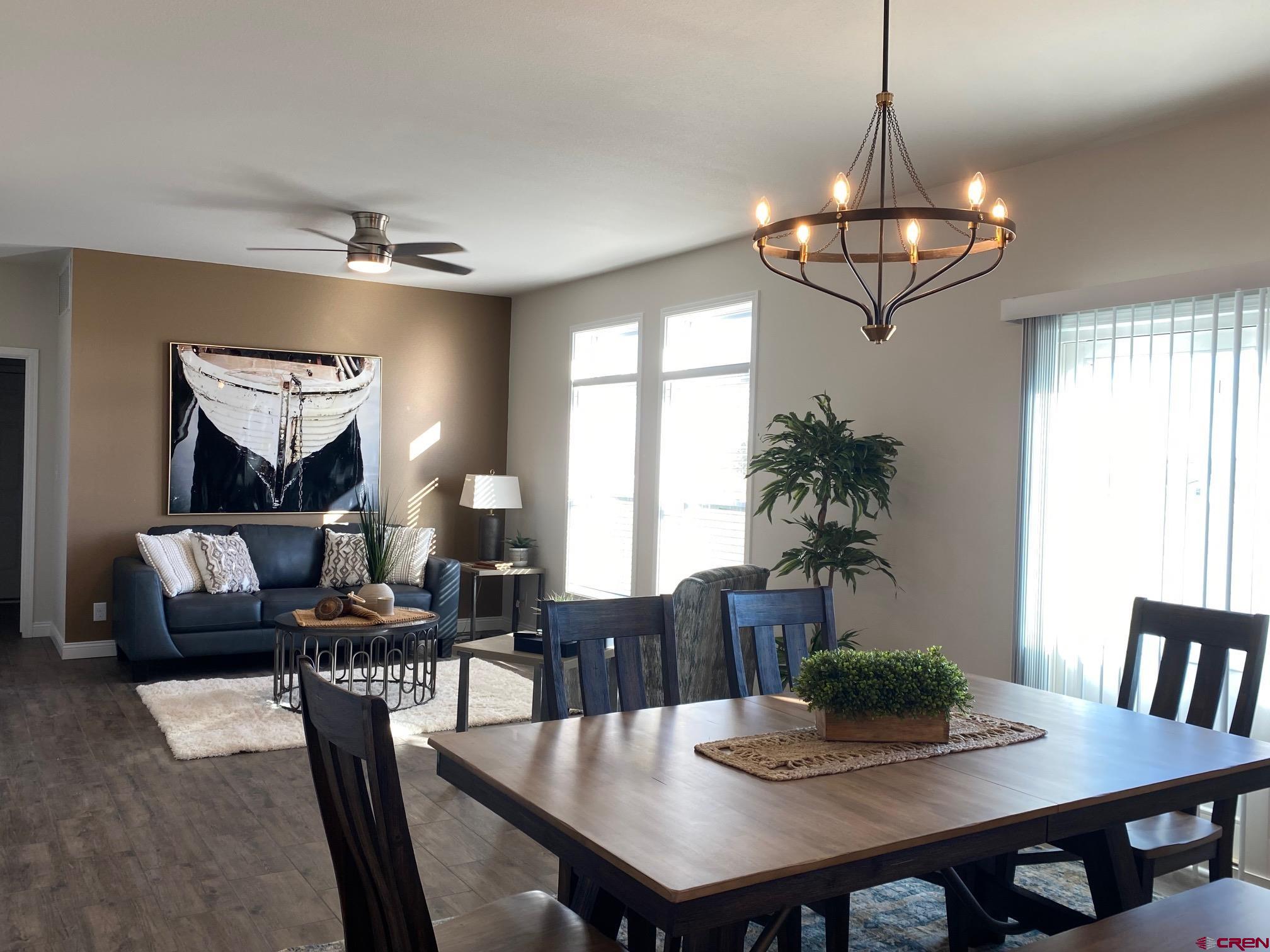 1230 H25 Road Delta, CO 81416 - Photo 10 of 34 a view of a dining room with furniture window and wooden floor