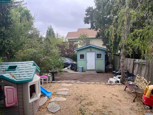 a view of backyard and deck