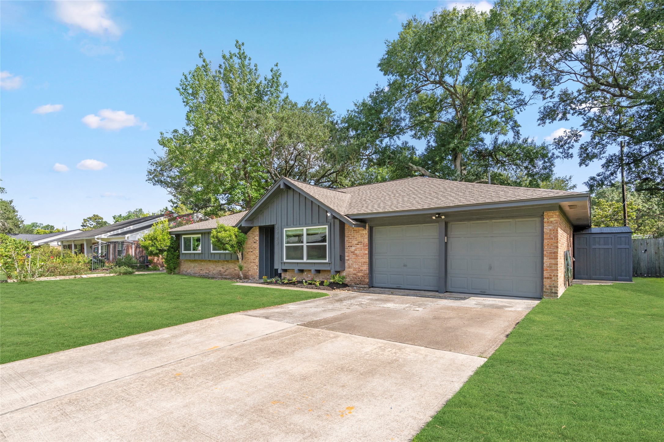 5723 Spellman Road Houston, TX 77096 - Photo 1 of 29 The long driveway provides plenty of parking and leads to the attached two-car garage. Mature trees and established landscaping give the home great curb appeal. New roof in 2024.