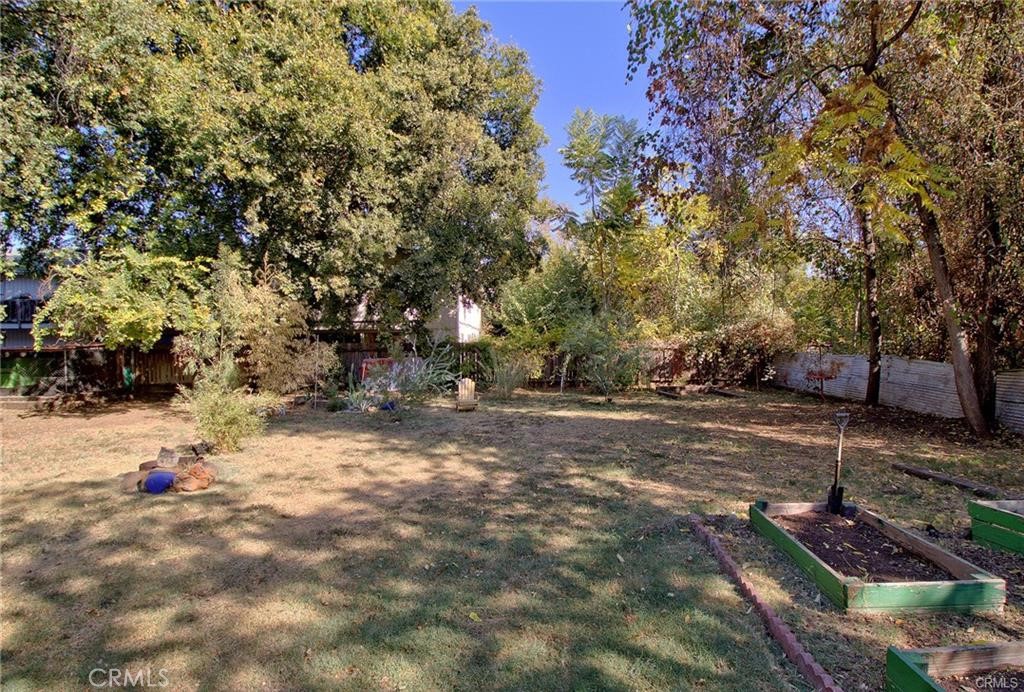 951 Walnut Street Chico, CA 95928 - Photo 10 of 11 a backyard of a house with lots of green space
