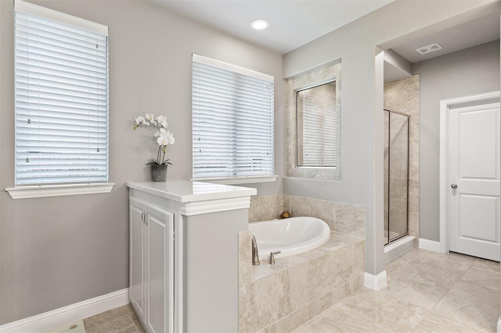 1003 Fenwick Lane Forney, TX 75126 - Photo 13 of 39 a bathroom with a sink toilet and shower