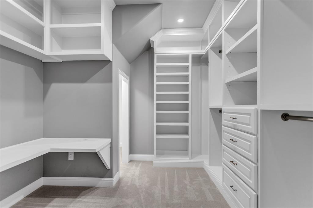 1003 Fenwick Lane Forney, TX 75126 - Photo 15 of 39 a view of walk in closet with empty racks