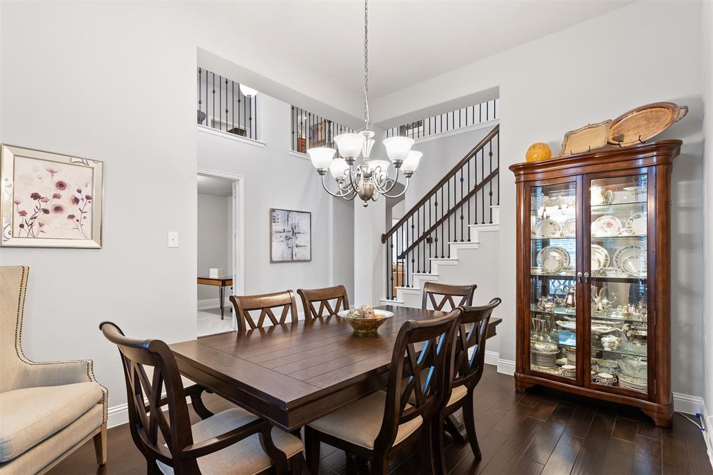 1003 Fenwick Lane Forney, TX 75126 - Photo 16 of 39 a view of a dining room with furniture and wooden floor