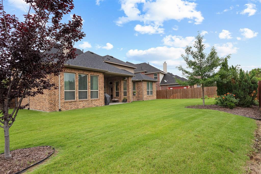1003 Fenwick Lane Forney, TX 75126 - Photo 2 of 39 a view of a house with a backyard