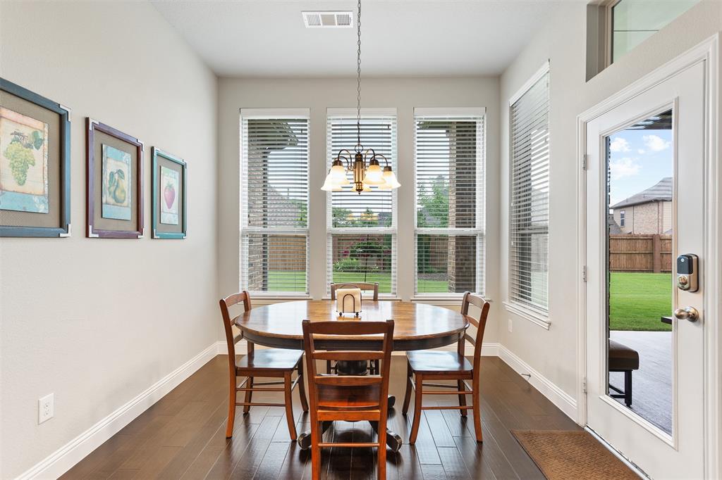 1003 Fenwick Lane Forney, TX 75126 - Photo 21 of 39 a view of a dining room with furniture window and outside view