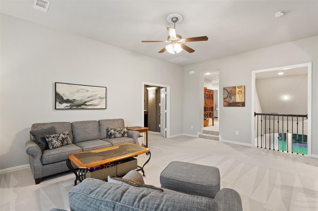 1003 Fenwick Lane Forney, TX 75126 - Photo 27 of 39 a living room with furniture and a ceiling fan