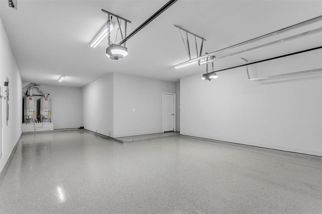 1003 Fenwick Lane Forney, TX 75126 - Photo 32 of 39 an empty room with a ceiling fan and windows
