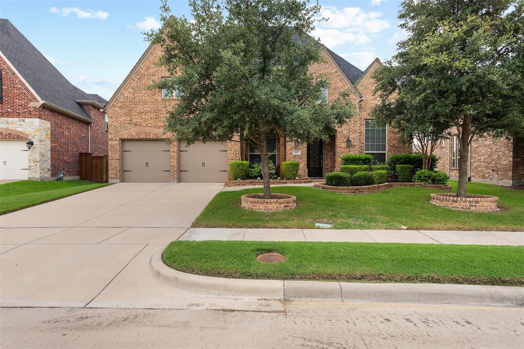 1003 Fenwick Lane Forney, TX 75126 - Photo 36 of 39 a view of a house with a yard and plants