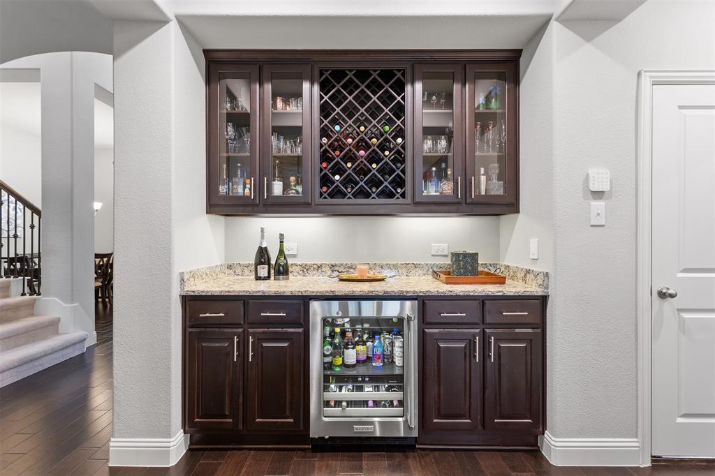 1003 Fenwick Lane Forney, TX 75126 - Photo 4 of 39 a bathroom with a wooden floor and a sink