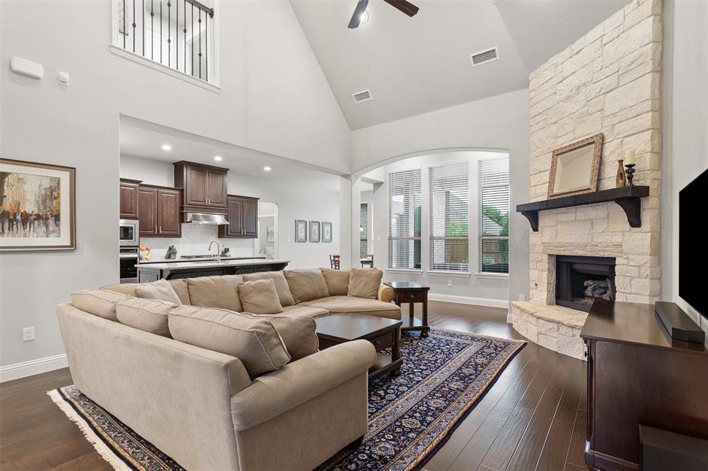 1003 Fenwick Lane Forney, TX 75126 - Photo 5 of 39 a living room with furniture and a fireplace