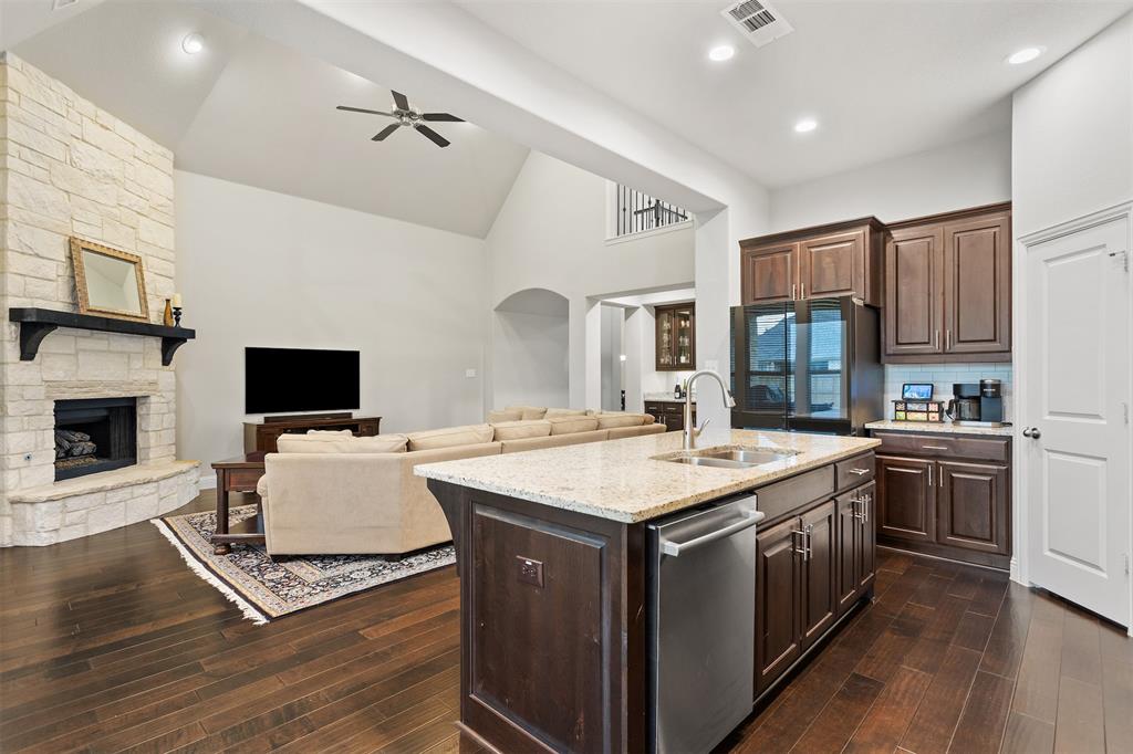 1003 Fenwick Lane Forney, TX 75126 - Photo 6 of 39 a view of kitchen with sink stove top oven and cabinets