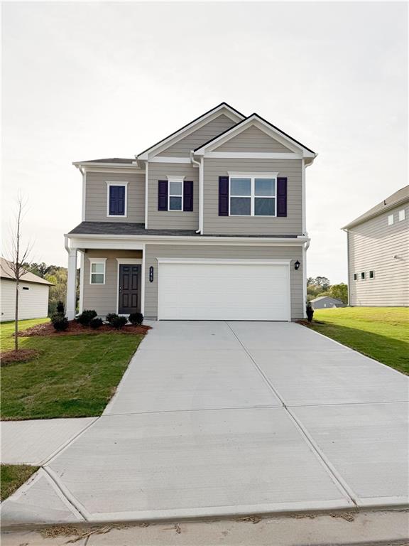a view of house with a yard