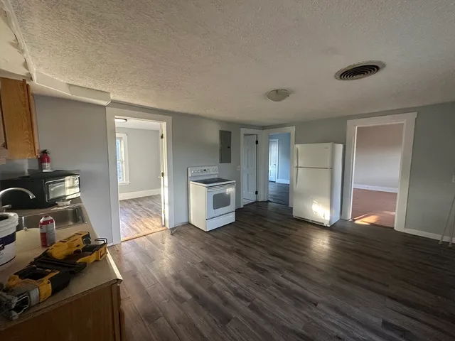 a view of a room with wooden floor and closet
