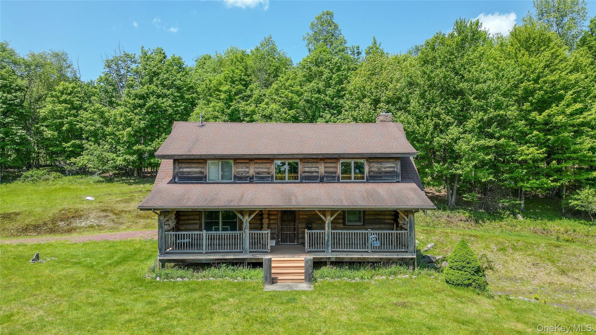 25 Cauthers Road Fallsburg, NY 12789 - Photo 3 of 27 an aerial view of a house with swimming pool and a yard
