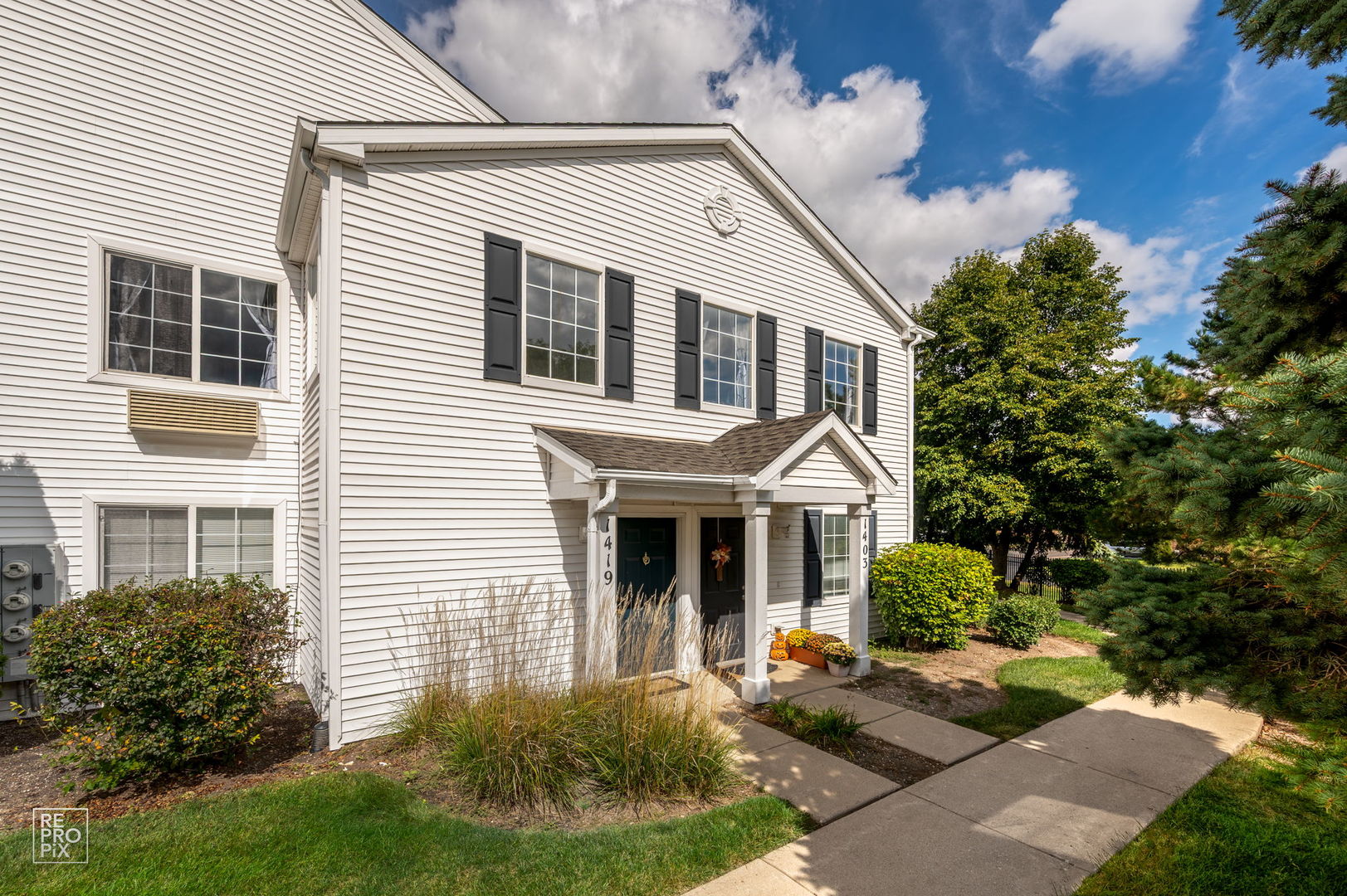1419 McClure Road, Unit 1419 Aurora, IL 60505 - Photo 1 of 12 a front view of a house with garden
