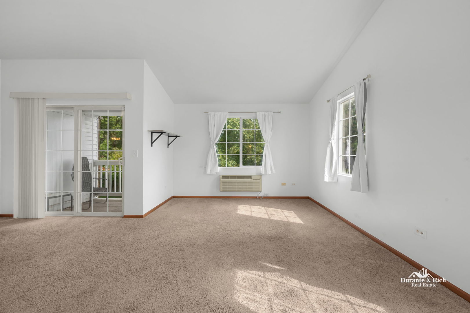 1419 McClure Road, Unit 1419 Aurora, IL 60505 - Photo 4 of 12 an empty room with windows