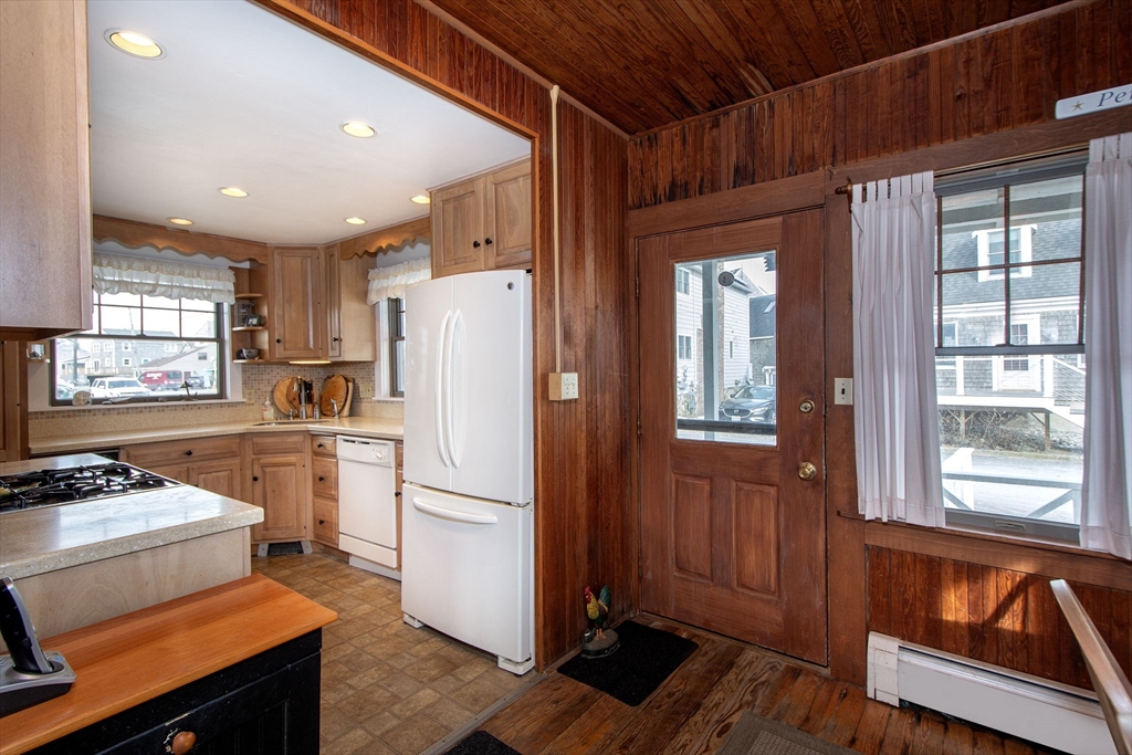 42 Lighthouse Road Scituate, MA 02066 - Photo 12 of 27 a kitchen with a refrigerator and a stove