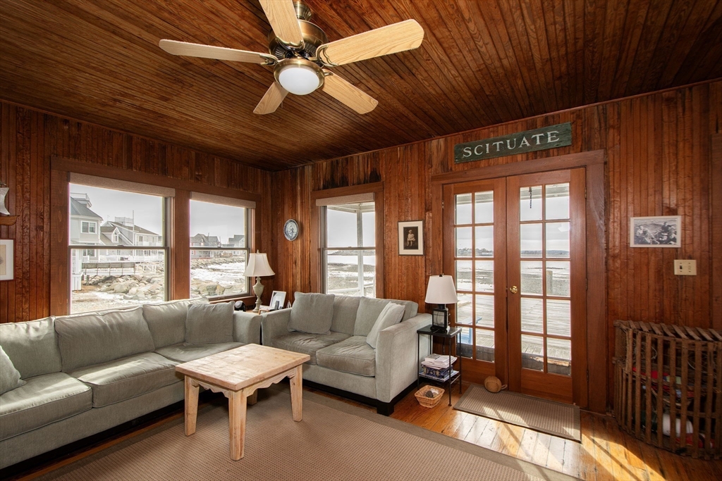 42 Lighthouse Road Scituate, MA 02066 - Photo 18 of 27 a living room with furniture a ceiling fan and a large window