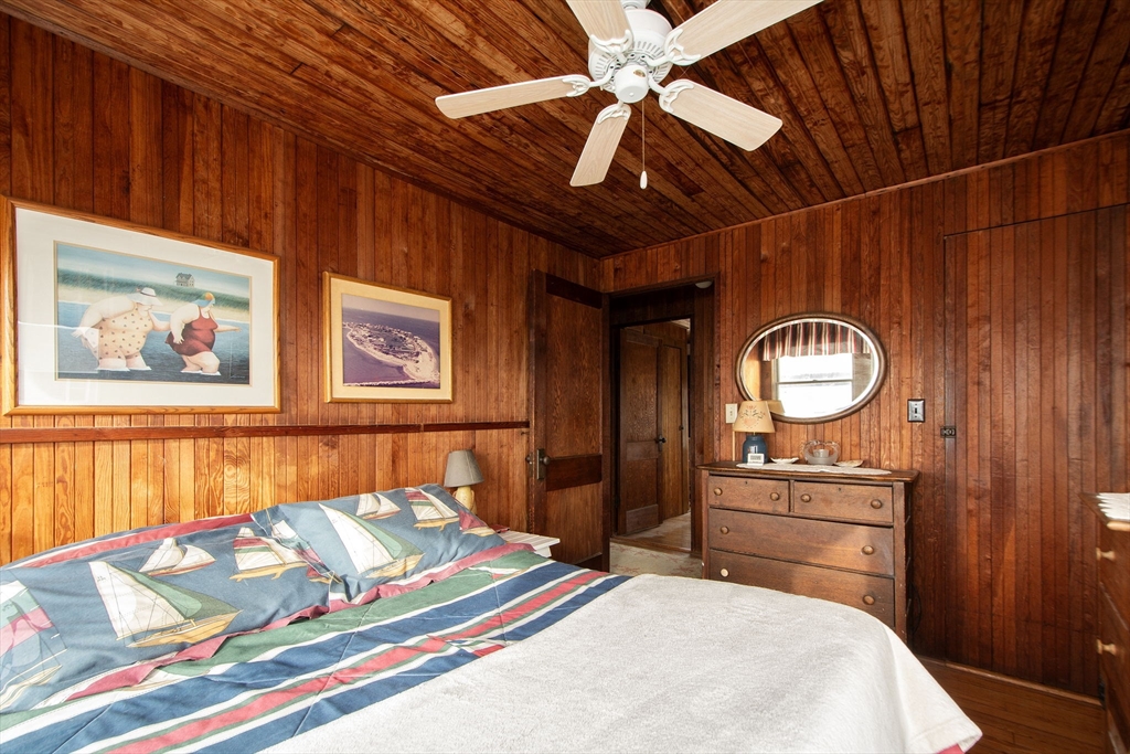42 Lighthouse Road Scituate, MA 02066 - Photo 23 of 27 a bedroom with a bed and a dresser